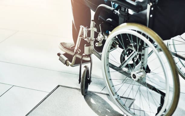 Closeup shot of an unrecognizable man sitting in a wheelchair